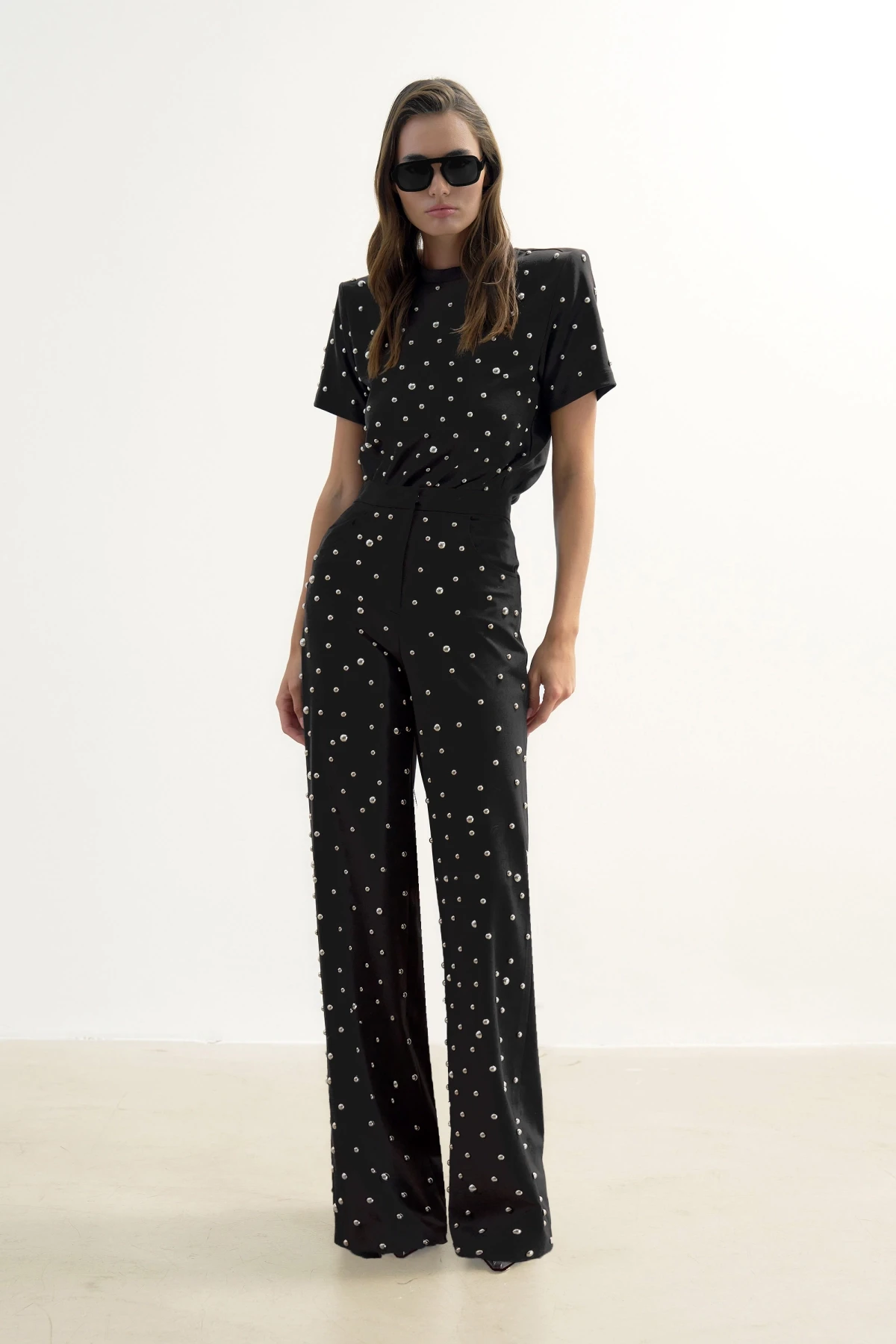BLACK TROUSERS WITH METALLIC STONE PRINT