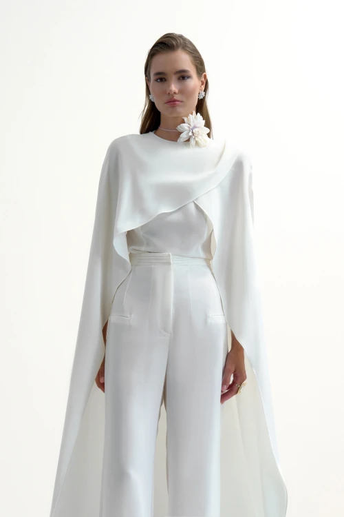OFF-WHITE TOP WITH CAPE DETAIL